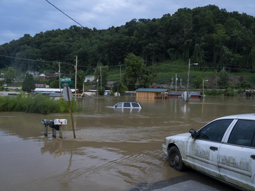 Vehicles after a flood in July 2022 in Jackson, Ky. Deadly floods in the region were caused by very heavy rain.