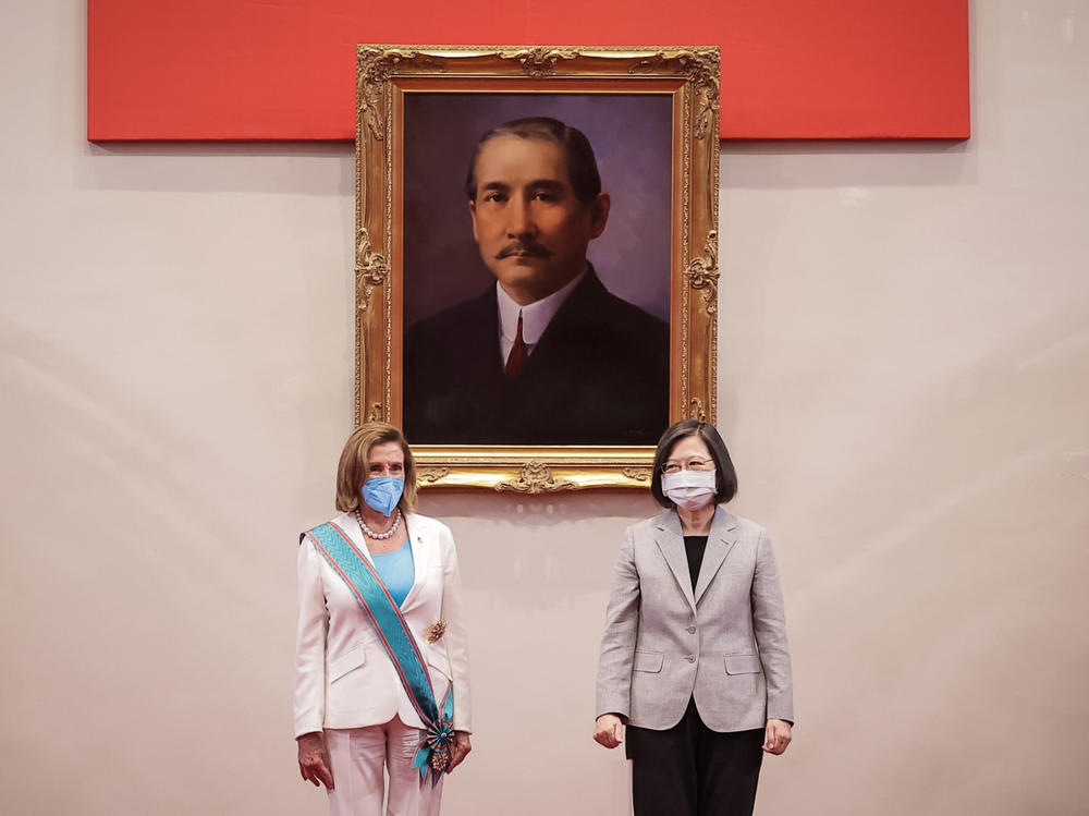 Speaker of the U.S. House Of Representatives Nancy Pelosi (D-CA), left, poses for photographs after receiving the Order of Propitious Clouds with Special Grand Cordon, Taiwan's highest civilian honour, from Taiwan's President Tsai Ing-wen, right, at the president's office on August 03, 2022 in Taipei, Taiwan.