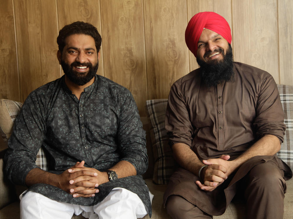 Friends Nasir Dhillon (left) and Papinder Singh run a YouTube channel, Punjabi Lehar, that tries to heal the wounds of Partition through reuniting loved ones separated when British-ruled India was divided into two countries, India and Pakistan, 75 years ago.