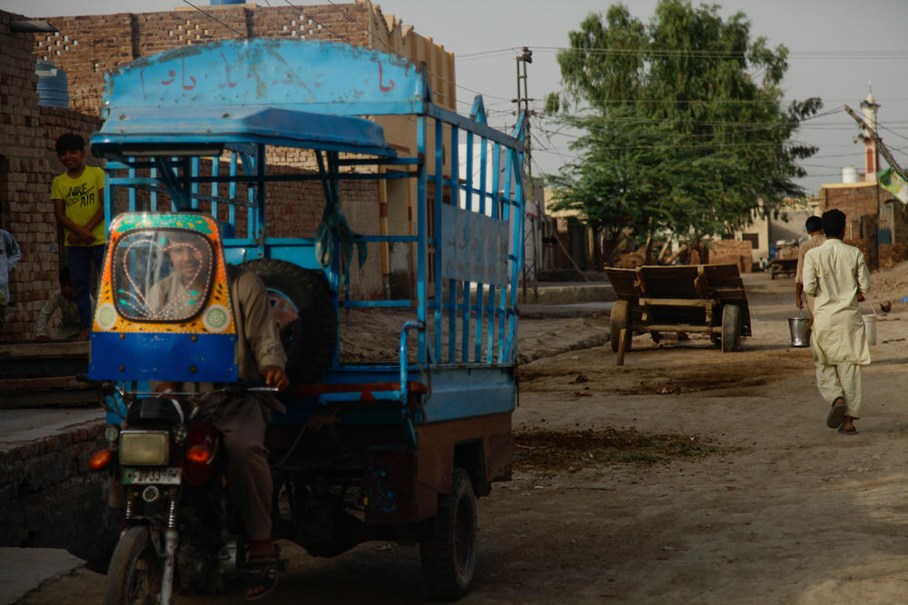 An auto rickshaw idles up the road from the Burewala train station, where the man who Sharifa Bibi believes was her brother likely visited twice — once as a child and again as an adult — to try to find his family. On his second attempt, 35 years ago, he met horse-and-cart driver Mohammed Asghar, who introduced the man to area residents and helped spread the word of the man's search for his family.
