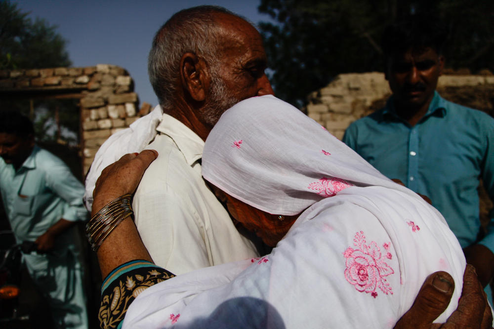 Mohammed Asghar embraces Sharifa Bibi at his home in a village near Burewala, Pakistan. It's unusual for an elderly man and elderly woman who are not related to each other to embrace as Asghar and Sharifa Bibi do. But Asghar has taken on a role as an honorary brother to Sharifa Bibi since meeting an Indian man 35 years ago who they believe was her long-lost brother.