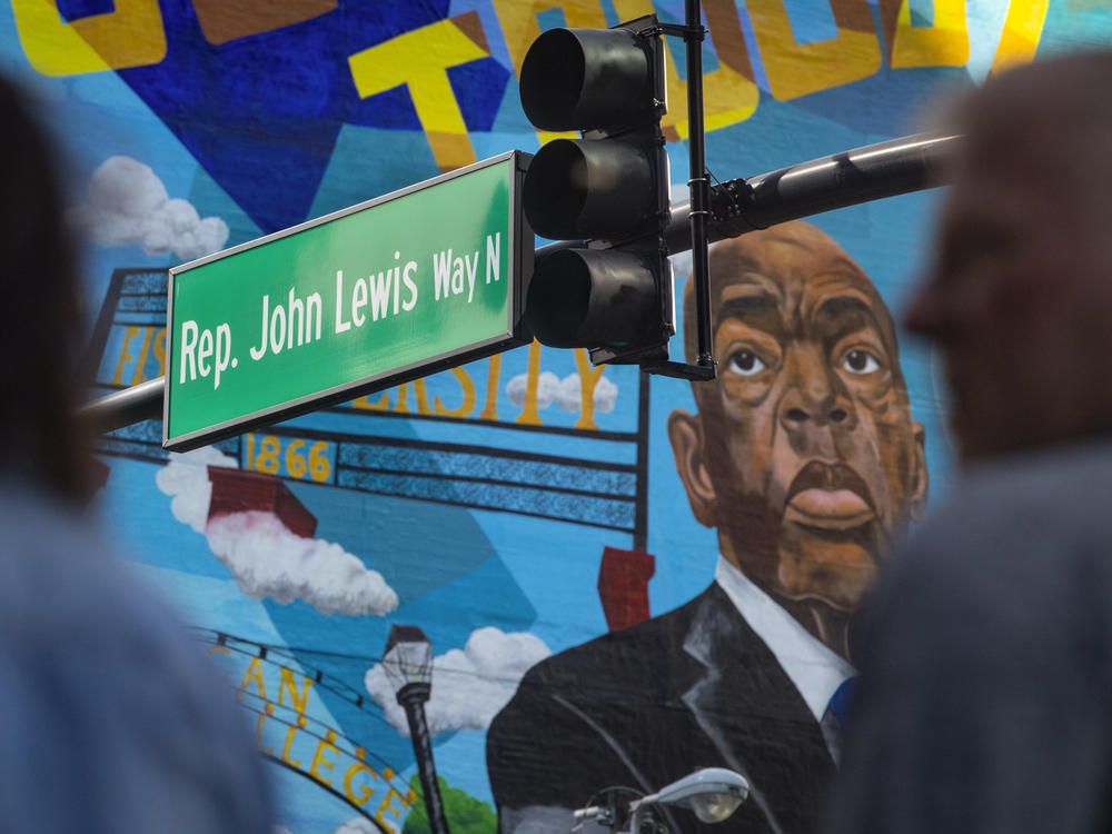 A mural of Rep. John Lewis on a street named after him Feb. 11, in Nashville, Tenn. The late Lewis was part of a movement that marched downtown from the historically Black neighborhood of North Nashville to take part in lunch counter sit-ins. That same neighborhood is redistricted into a mostly white congressional district, which some Democrats are comparing past civil rights violations.