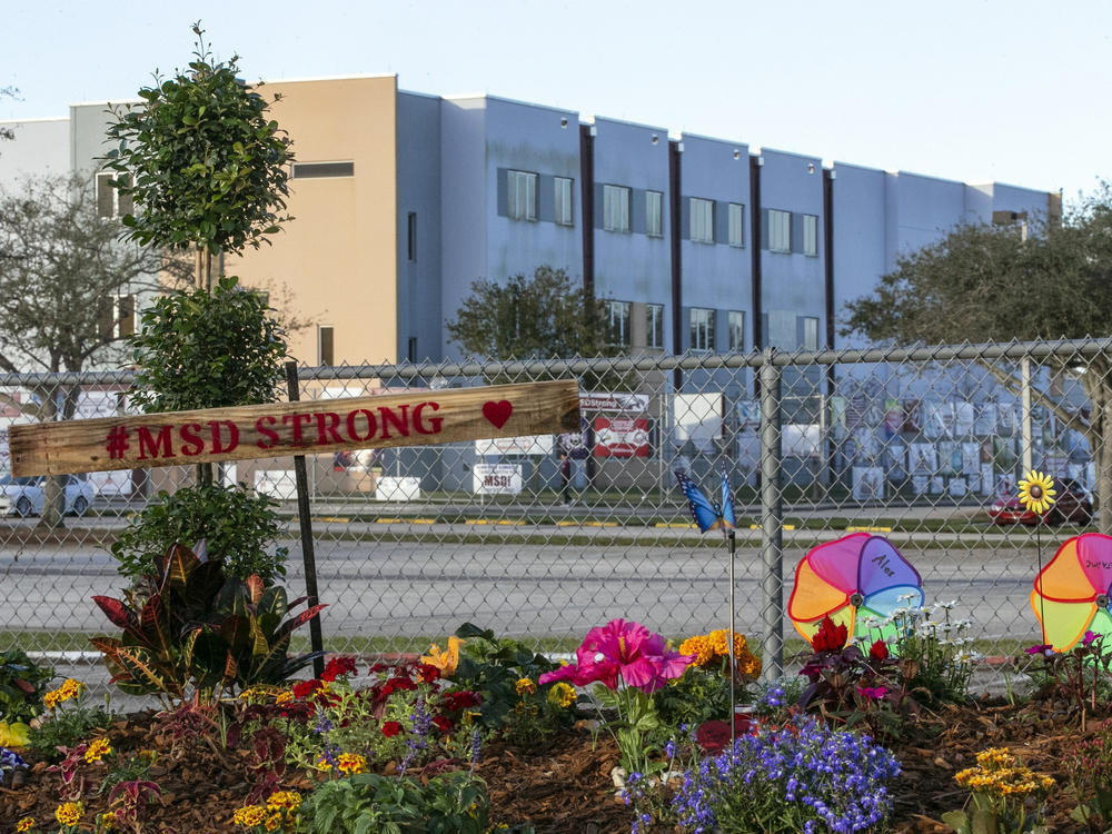 A memorial to the victims is seen outside Marjory Stoneman Douglas High School in Parkland, Fla., on Feb. 14, 2019, during the one-year anniversary of the school shooting.