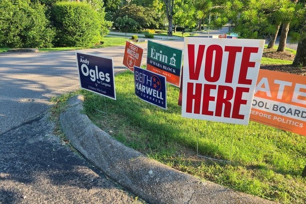 Signs for the top three Republican candidates for Tennessee's 5th Congressional District — Andy Ogles, Beth Harwell and Kurt Winstead — stand amid other placards at a polling site in Nashville, Tenn.