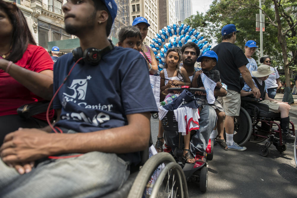 People take part in the first annual Disability Pride Parade in New York City on July 12, 2015.
