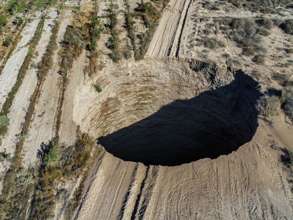 An aerial view shows the large sinkhole that appeared over the weekend near the mining town of Tierra Amarilla, Copiapo Province in Chile.
