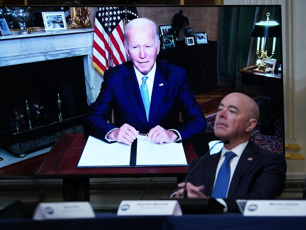 Homeland Security Secretary Alejandro Mayorkas listens as President Biden delivers remarks virtually during the first meeting of the interagency Task Force on Reproductive Healthcare Access on Wednesday.