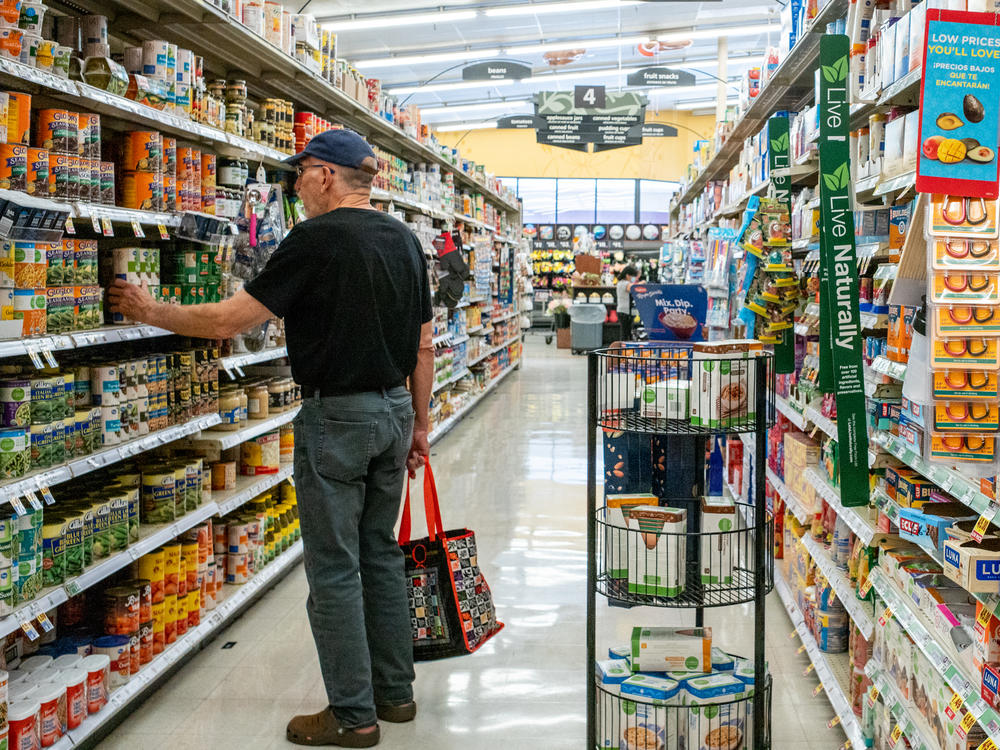 A customer shops in a grocery store on July 15 in Houston, Texas. The drop in gas prices in parts of the country could bring some relief to the inflation rate, although consumer prices still remain high.