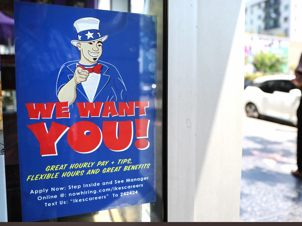 A 'We Want You!' sign is posted at an Ike's Love & Sandwiches store in Los Angeles on July 26.