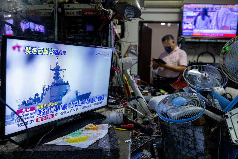 A television in Taipei, Taiwan, shows a news broadcast about China's live-fire drill around Taiwan on Thursday after Speaker of the House Nancy Pelosi's visit the day before.