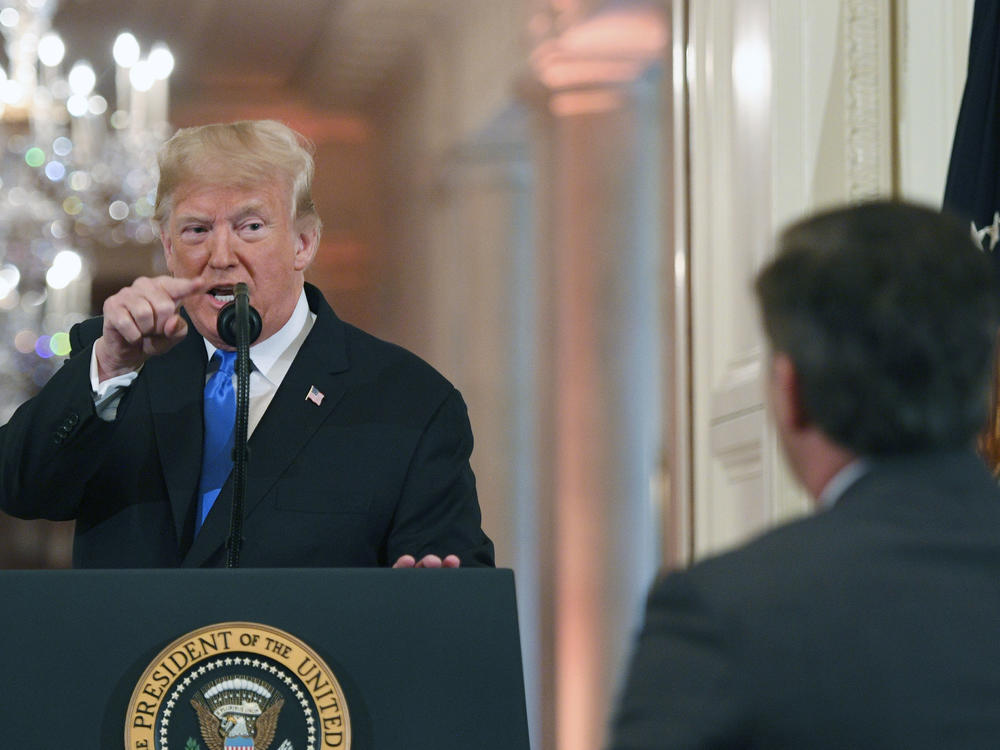 Then-President Donald Trump points to journalist Jim Acosta from CNN during a post-election press conference in the East Room of the White House in Washington, DC on Nov. 7, 2018. During the exchange, Trump called the reporter 