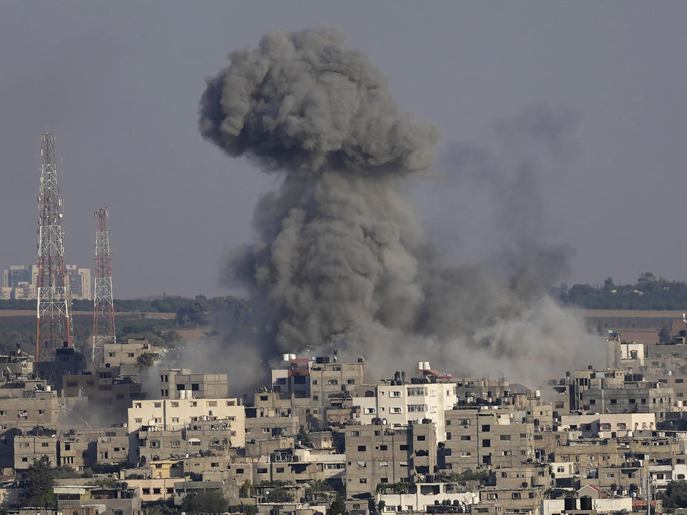 Smoke rises after Israeli airstrikes on a residential building in Gaza on Sunday.