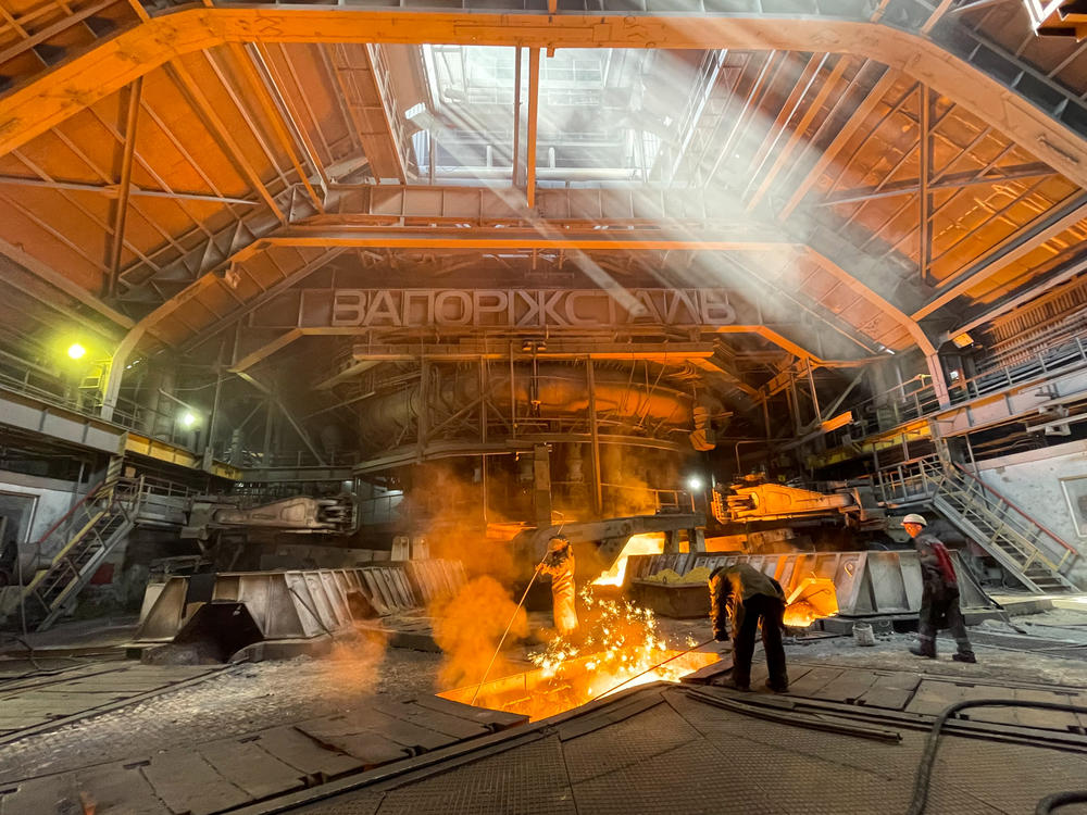 Workers at Zaporizhstal iron and steel works on July 22 in Zaporizhzhia, Ukraine.