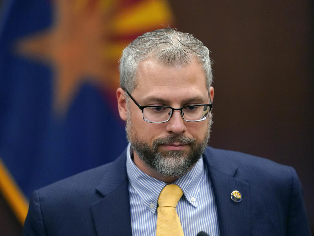 Pinal County Attorney Kent Volkmer listens to complaints while addressing Election Day ballot shortages in the county.