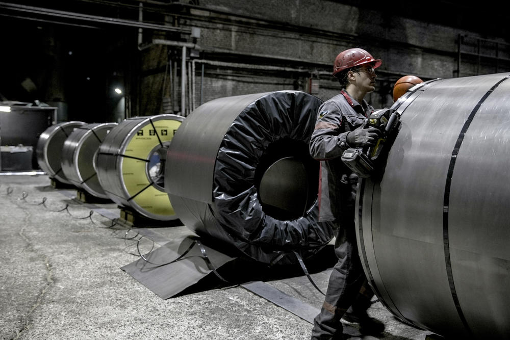 Employees secure and package rolls of sheet steel at the Zaporizhstal PJSC rolled steel plant in Zaporizhzhia, Ukraine, on June 30.