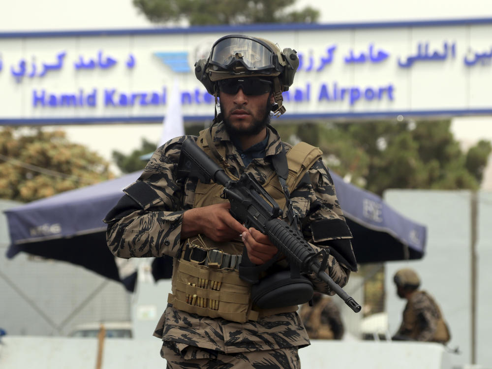 Taliban special force fighters stand guard outside the Hamid Karzai International Airport after the U.S. military's withdrawal, in Kabul, Afghanistan, Tuesday, Aug. 31, 2021.