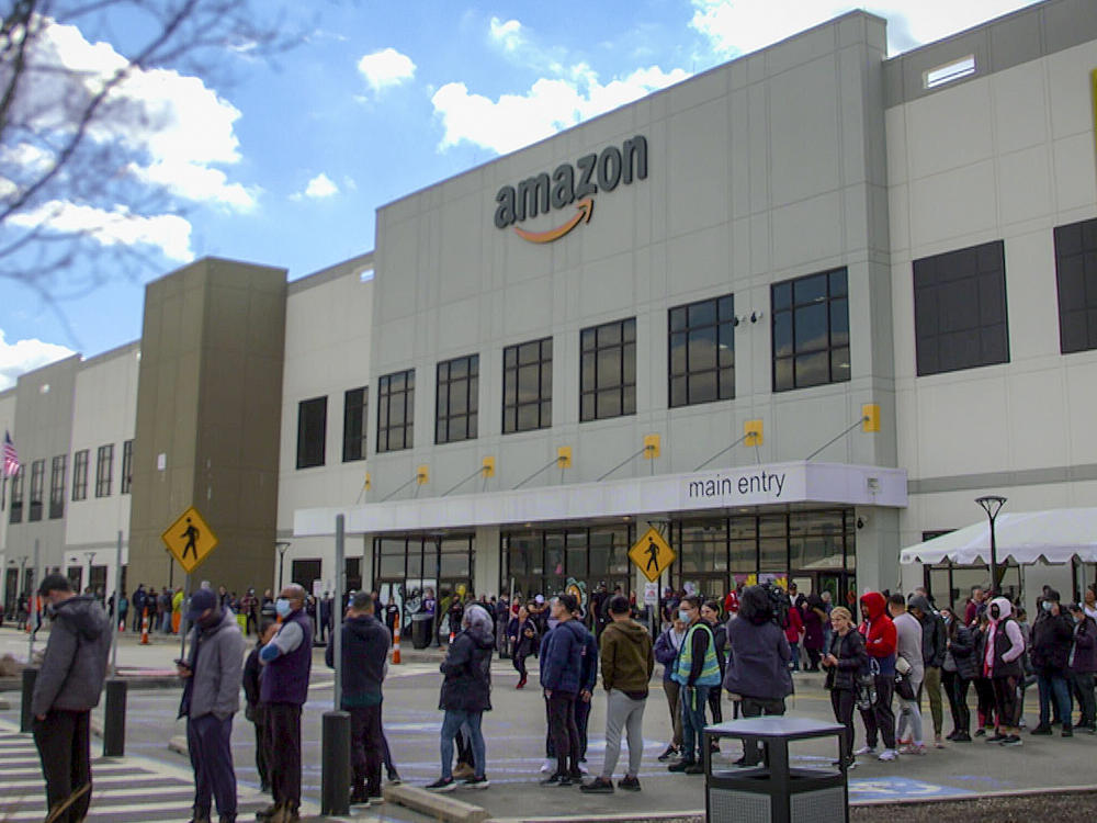 Workers line up to vote on unionization at Amazon's warehouse in Staten Island on March 25.