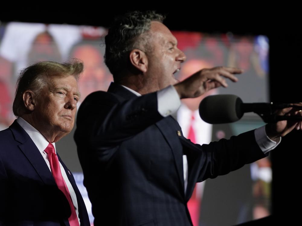 Tim Michels, Wisconsin Republican candidate for governor, right, speaks as former President Donald Trump listens at a rally Friday, Aug. 5, 2022, in Waukesha, Wisc.
