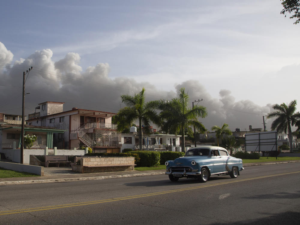 Smoke rises from a deadly fire at a large oil storage facility in Matanzas, Cuba, on Tuesday. The fire was triggered by lighting that struck one of the facility's eight tanks late Friday.