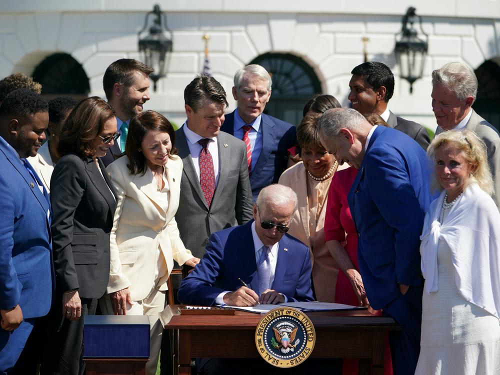 President Biden signed the CHIPS and Science Act on the South Lawn of the White House on Tuesday. The legislation is aimed at boosting the domestic production of semiconductors.