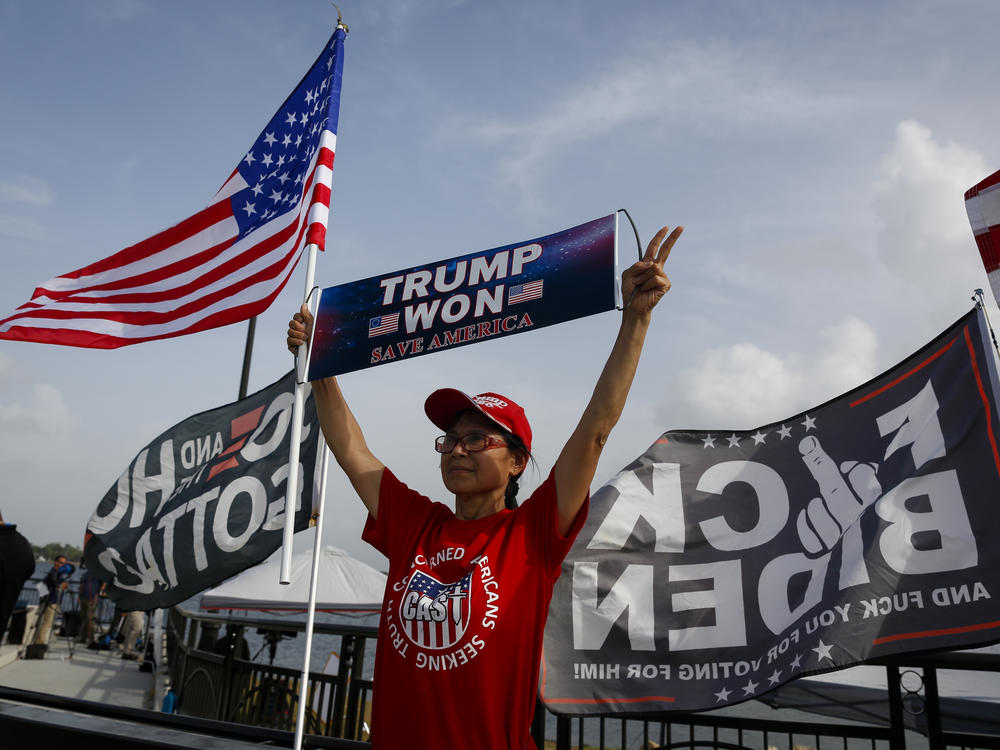 Supporters of former US President Donald Trump outside Mar-A-Lago in Palm Beach, Florida, US, on Tuesday, Aug. 9, 2022. Donald Trump faces intensifying legal and political pressure after FBI agents searched his Florida home in a probe of whether he took classified documents from the White House when he left office, casting a shadow on his possible run for the presidency in 2024.