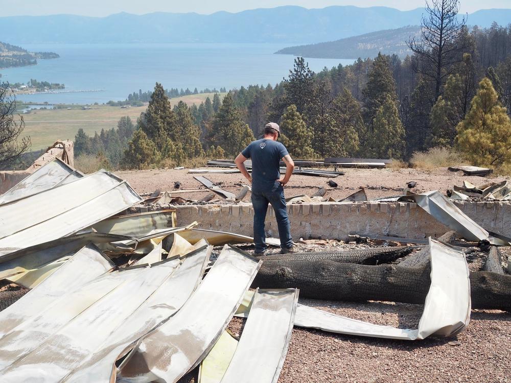 Steve Holett surveys the aftermath of the Elmo 2 Fire at his property, where he had spent the last 18 months building a home.