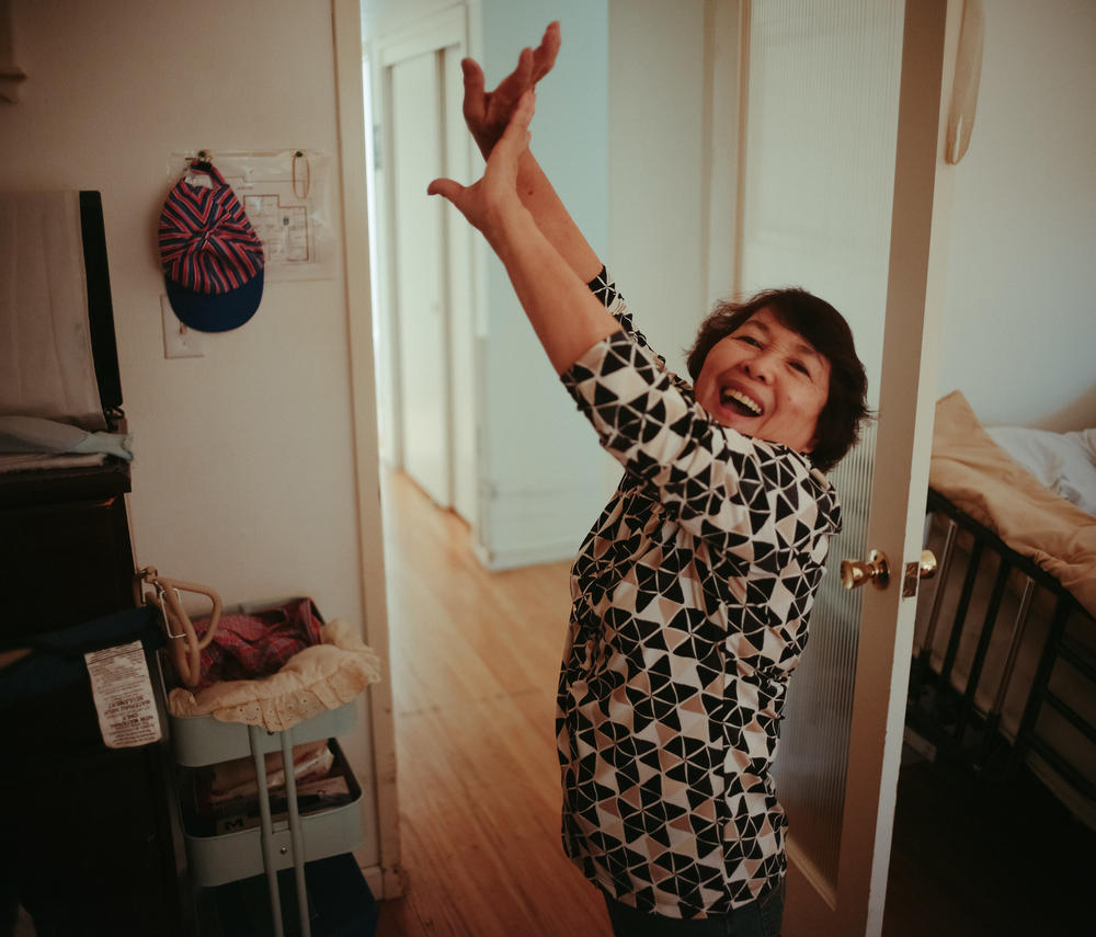 Perez, the owner of Hillcrest Care, a small assisted-living facility in El Dorado Hills, Calif., stretches after a long day of work on July 14, 2022. She's two years away from her 80th birthday, but she continues to exude vim and vigor as she hopes to continue pursuing her mission of delivering unmatched senior care in her community.