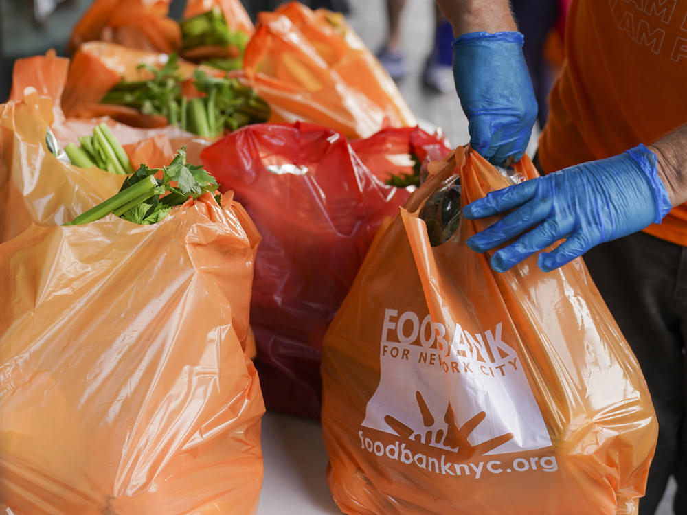 Fresh produce and shelf-stable pantry items are bagged for collection outside Barclays Center as Food Bank For New York City provides assistance to those in need due to the COVID-19 pandemic on Sept. 10, 2020.