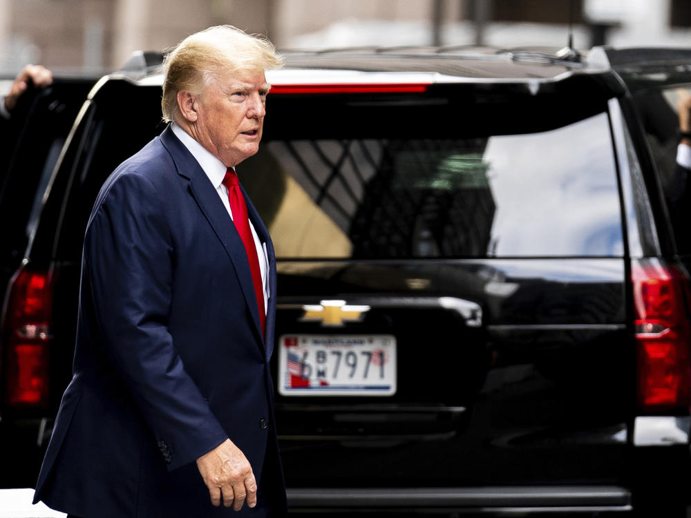 Former President Donald Trump departs Trump Tower on Wednesday in New York, on his way to the New York attorney general's office for a deposition in a civil investigation.