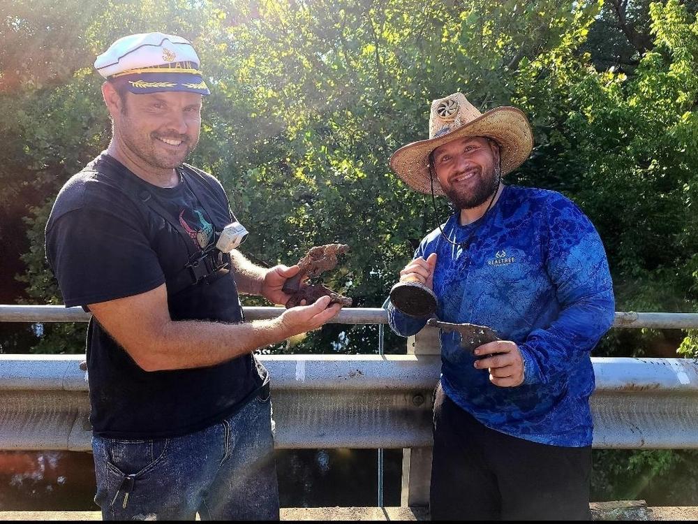 Brothers Jake and Adam Cowart show off a magnet fishing haul. They are among many who picked up the hobby during the pandemic.