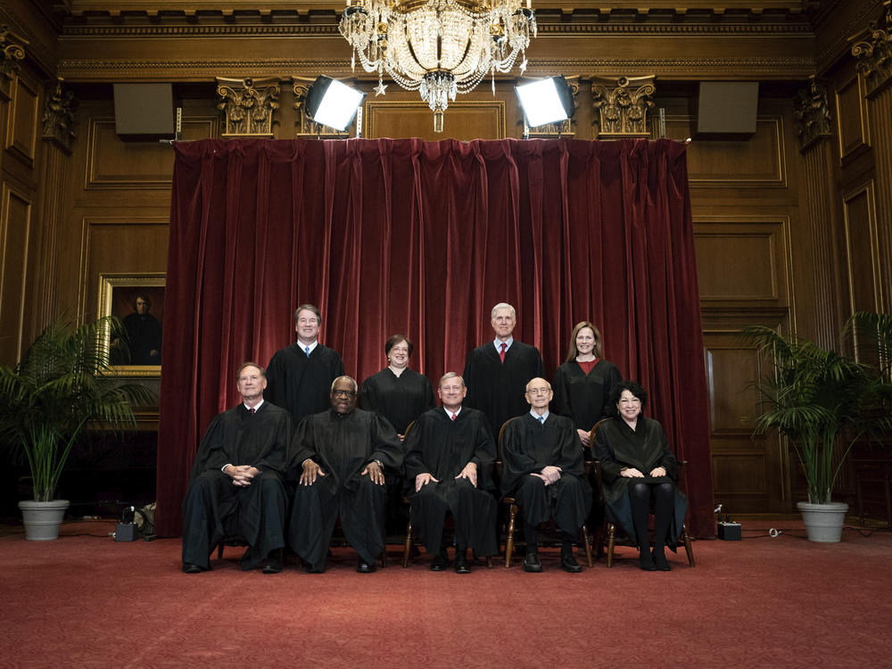 Members of the Supreme Court pose for a group photo at the Supreme Court in Washington on April 23, 2021. The increasingly conservative court has signaled a much fuller embrace of individual gun rights.