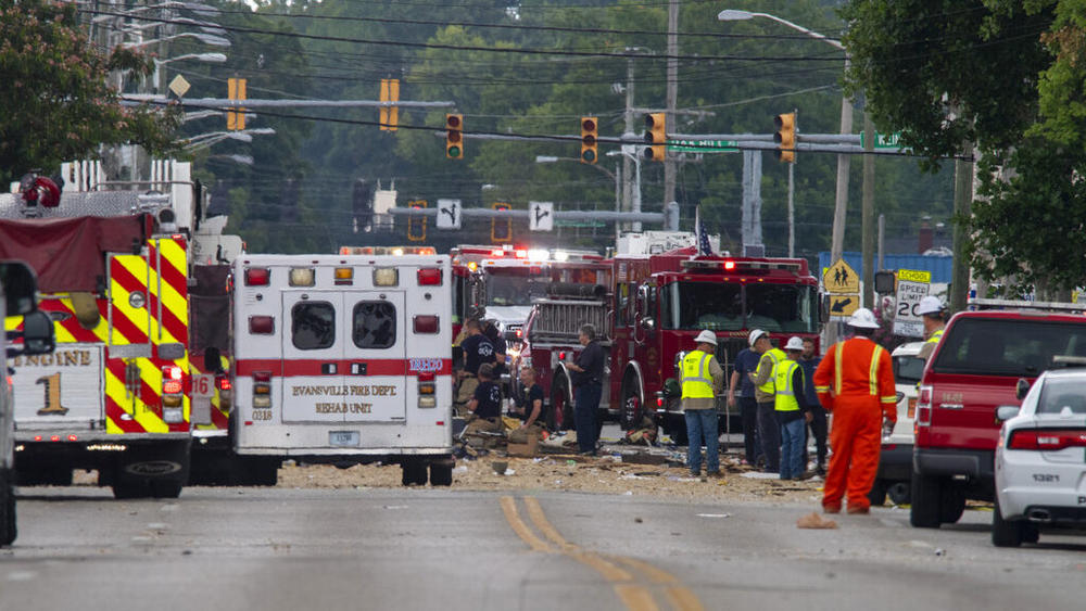 Emergency crews respond to a house explosion Wednesday on North Weinbach Avenue in Evansville, Ind., Wednesday.