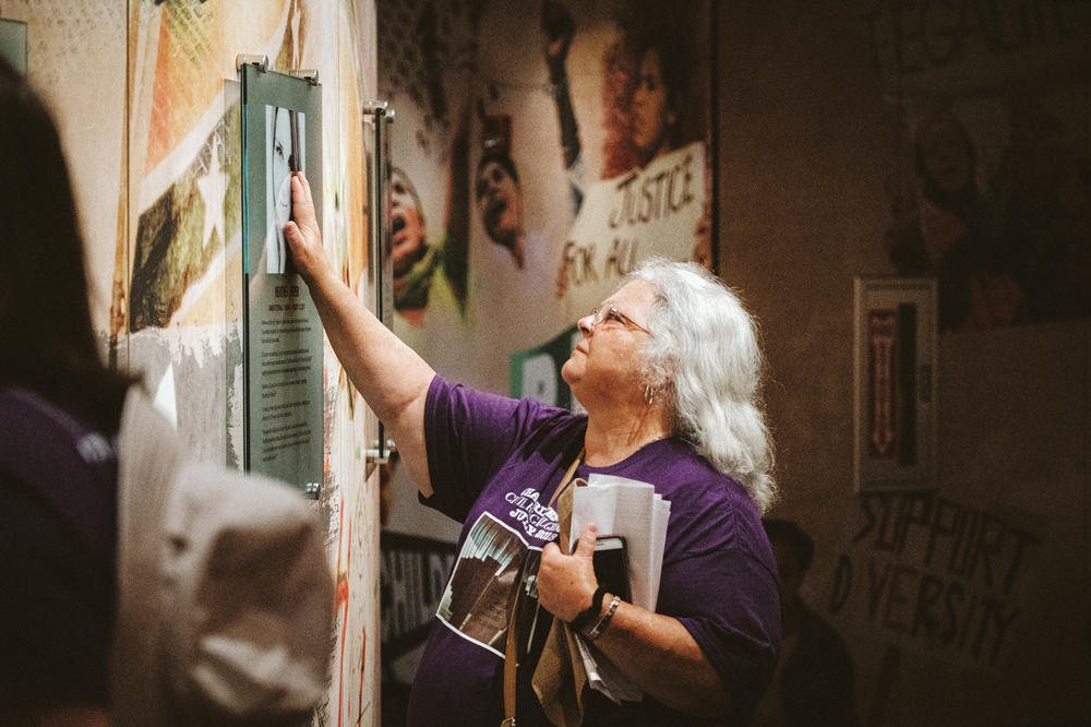 Heather Heyer's mom, Susan Bro, has a moment with a commemoration of her daughter at the Civil Rights Memorial Center in Montgomery, Ala.