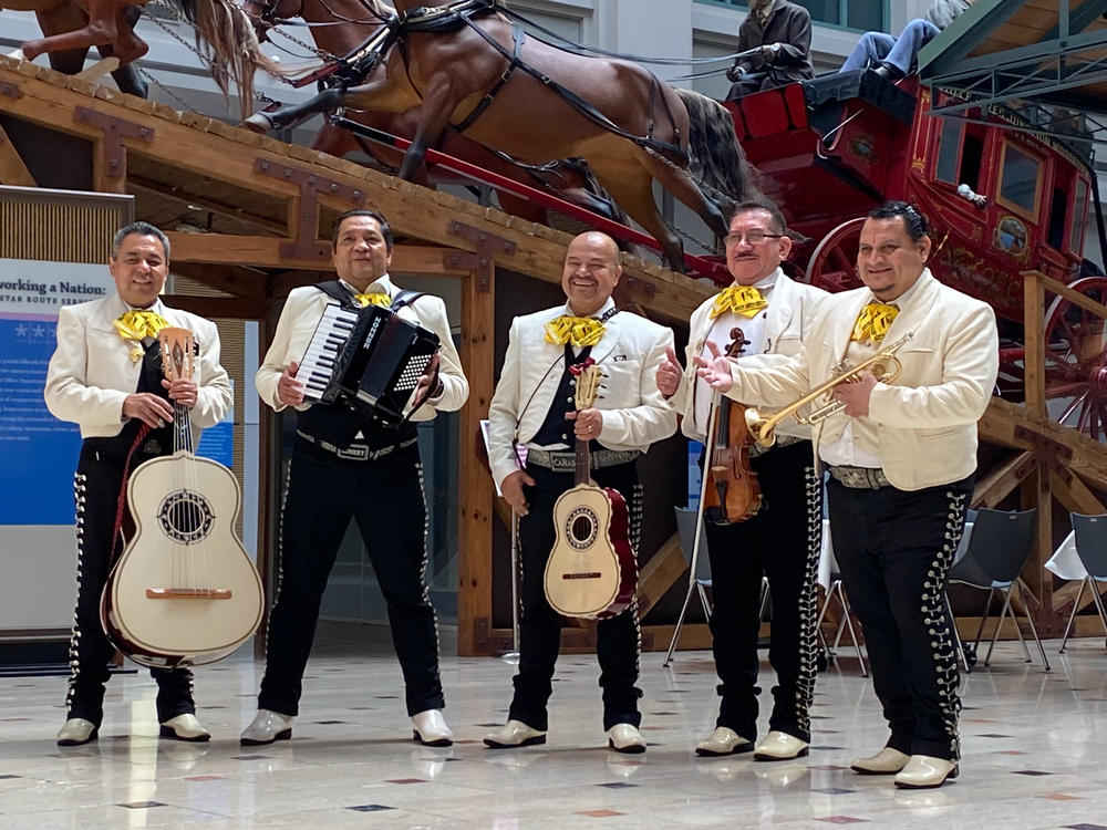 Members of Cañas y su Mariachi de Oro prepare to play for the crowd at the museum.