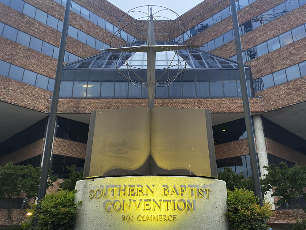 A cross and Bible sculpture stand outside the Southern Baptist Convention headquarters in Nashville, Tenn., on May 24. The Executive Committee of the Southern Baptist Convention says that several of the denomination's major entities are under investigation by the U.S. Department of Justice.
