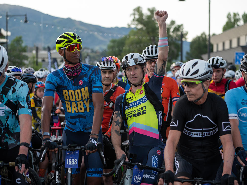 Activist and transgender cyclist Molly Cameron, third from right, next to former NBA player Reggie Miller, second from left, before the SBT GRVL race.