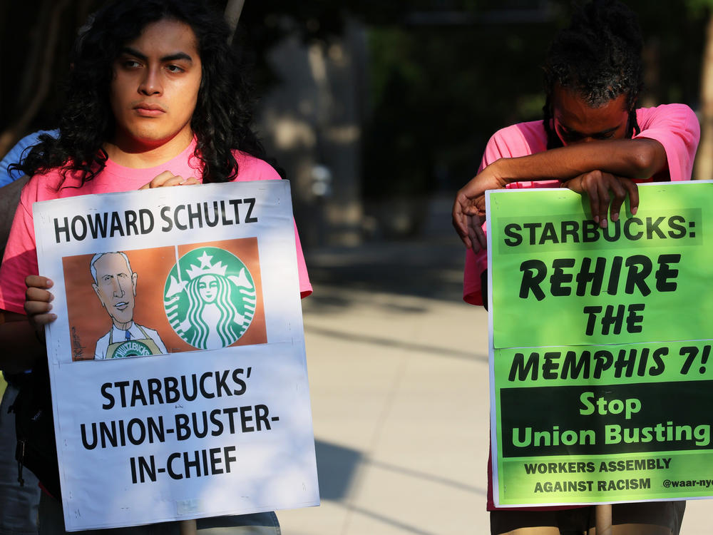 Starbucks says regional staff of the National Labor Relations Board repeatedly crossed the line of neutrality to help union organizers in Kansas. Here, activists protest against Starbucks CEO Howard Schultz in New York City last month.