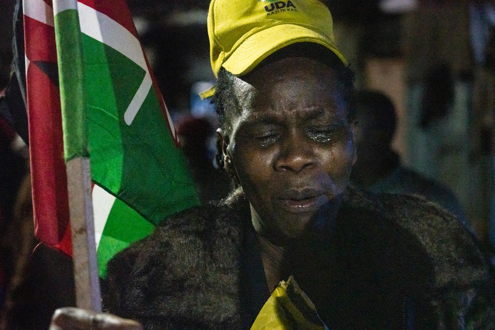 Irene Muthoni, a resident of the Mathare neighborhood in Nairobi, cries as she celebrates the election of president-elect William Ruto.