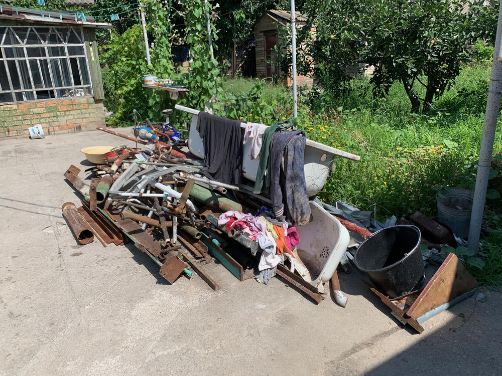Some of Dima Malichenko's belongings and parts of his house are seen on Saturday following a missile strike in Nikopol, Ukraine.
