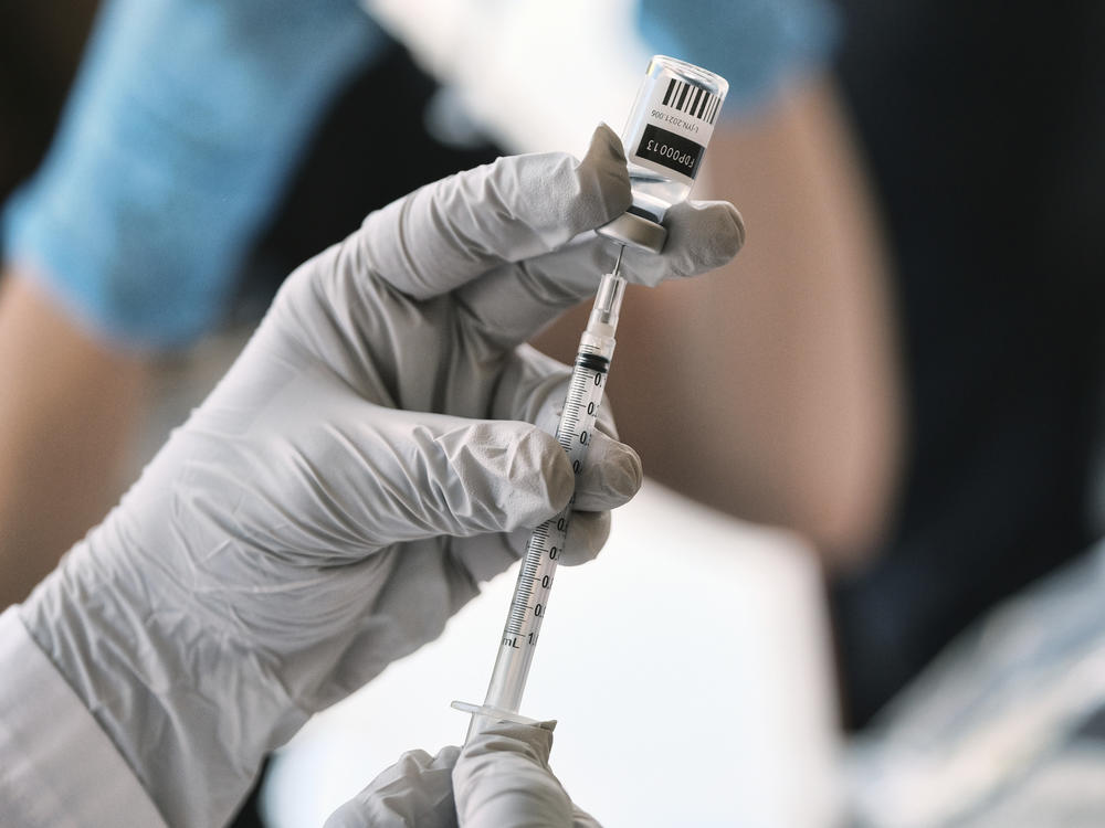 Registered pharmacist Sapana Patel, loads a syringe with monkeypox vaccine at a pop-up vaccination site on Wednesday, Aug. 3, 2022, in West Hollywood, Calif.