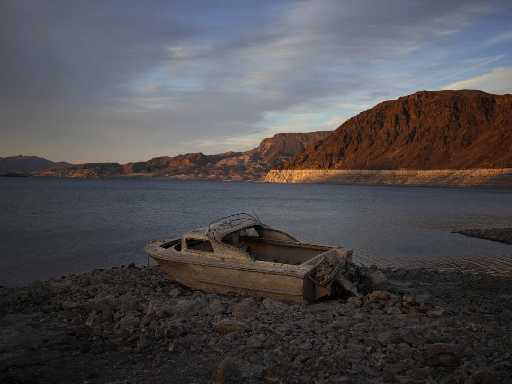 A formerly sunken boat sits high and dry along the shoreline of Lake Mead at the Lake Mead National Recreation Area, on May 10, near Boulder City, Nev.