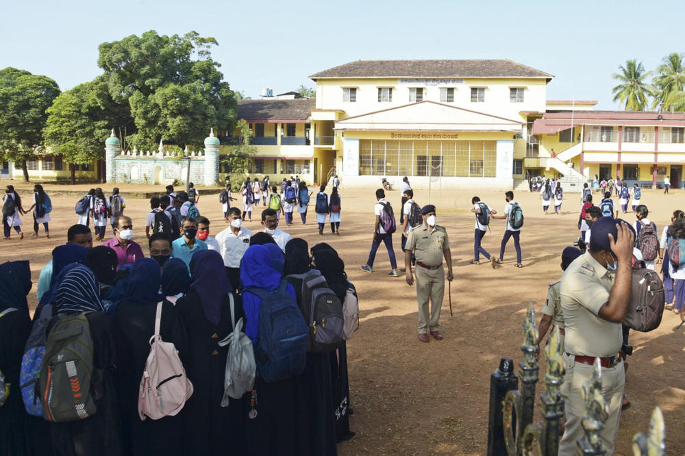 Students speak with the school principal after they arrived to school wearing hijabs at the pre-university college in Kundapur,  Udupi, India on February 7, 2022.