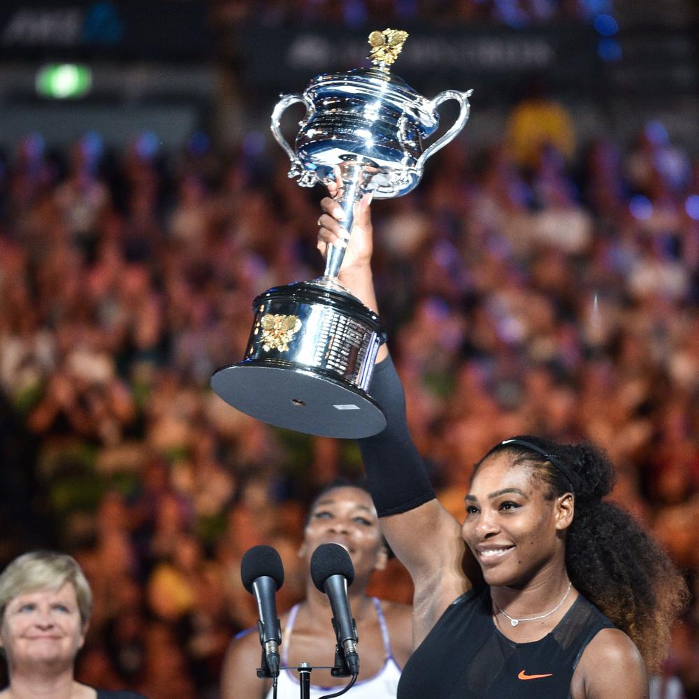 Serena Williams celebrates with the championship trophy after her victory in the women's singles final at the Australian Open tennis tournament in Melbourne in January 2017.