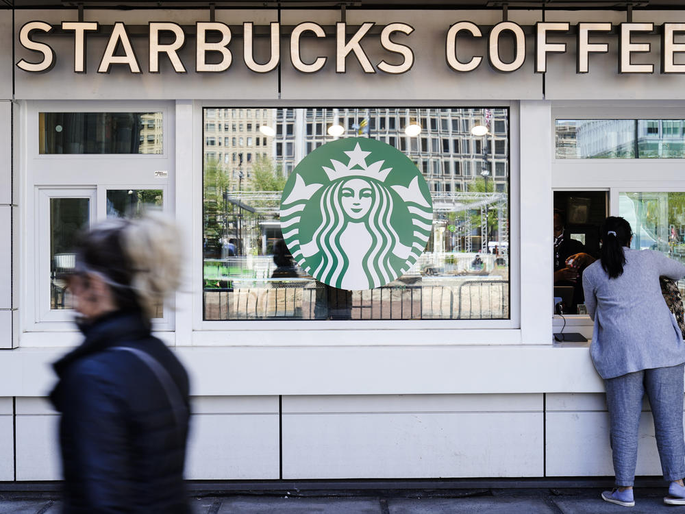 A customer makes a purchase at a Starbucks coffee shop.