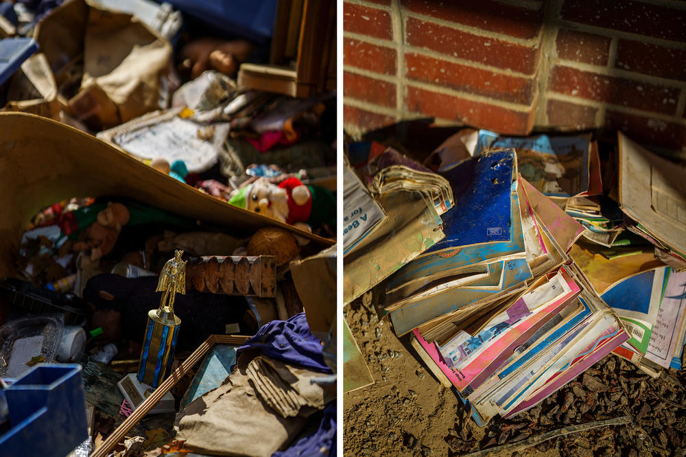 A trophy, books and other artifacts scattered by the flood sit at a storage facility, left, and the elementary school, right.