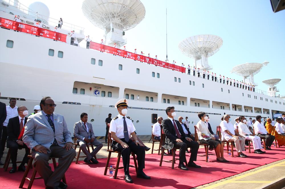 Chinese Ambassador to Sri Lanka Qi Zhenhong (front row, third from left) and captain of the Yuan Wang-5 ship, Zhang Hongwang (front row, second from left), attend a ceremony welcoming the Chinese ship to Sri Lanka's Hambantota International Port in Sri Lanka, Aug. 16.