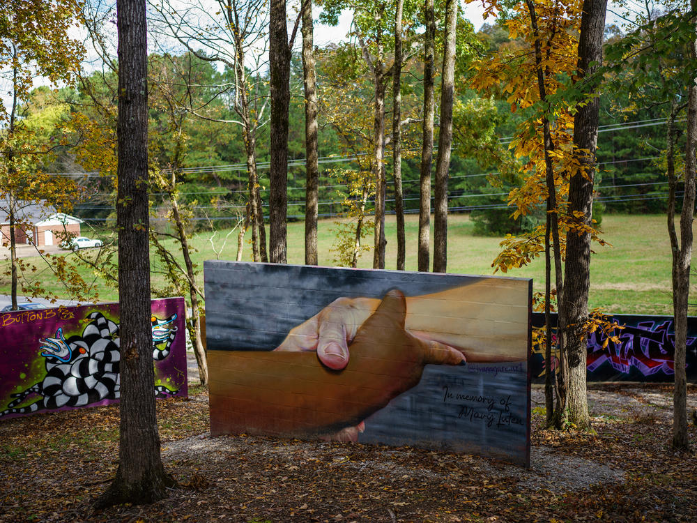 A mural in memory of Mary Luten, 59, who died while saving others in the Waverly flood, sits on display at The Walls Art Park. The flood on Aug. 21, 2021, killed 20 people and damaged more than 700 homes.