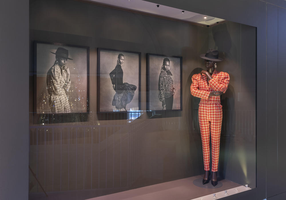 Chris Seydou's orange checkered suit and wide brimmed hat is ready to strut at the 
