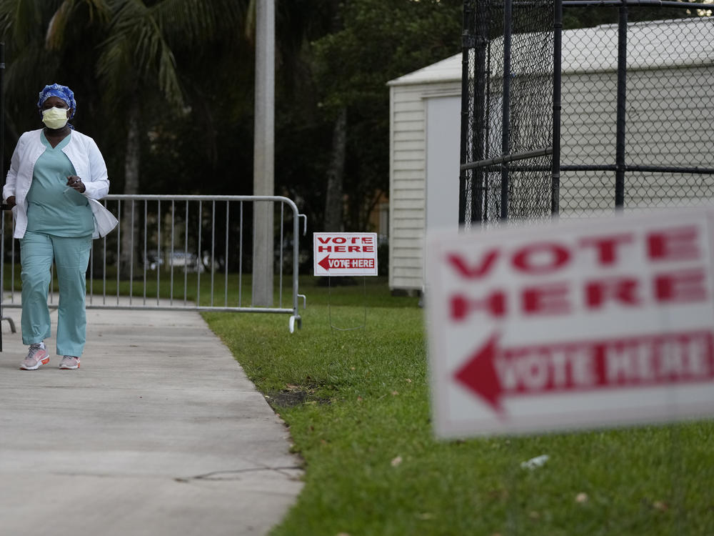 A voter leaves after casting her ballot in a special congressional election on Jan. 11 in Miramar, Fla.