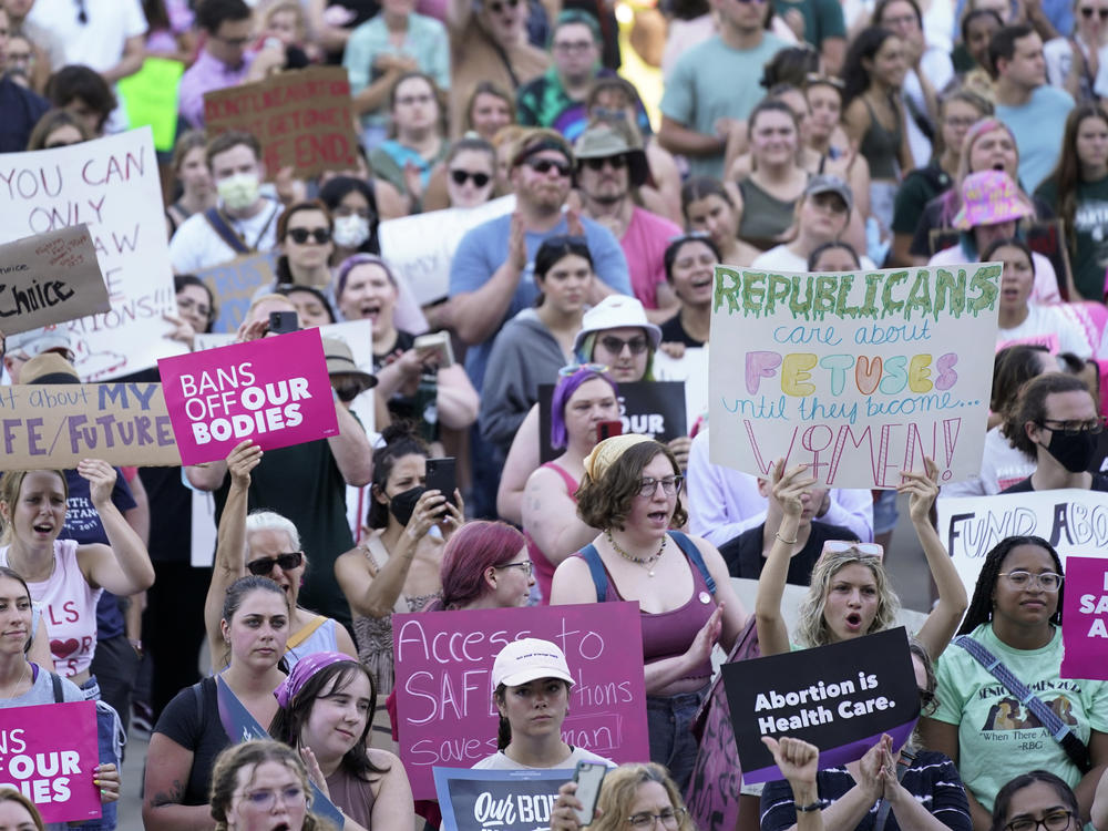 Abortion rights protesters attend a June 24 rally following the United States Supreme Court's decision to overturn <em>Roe v. Wade</em>.